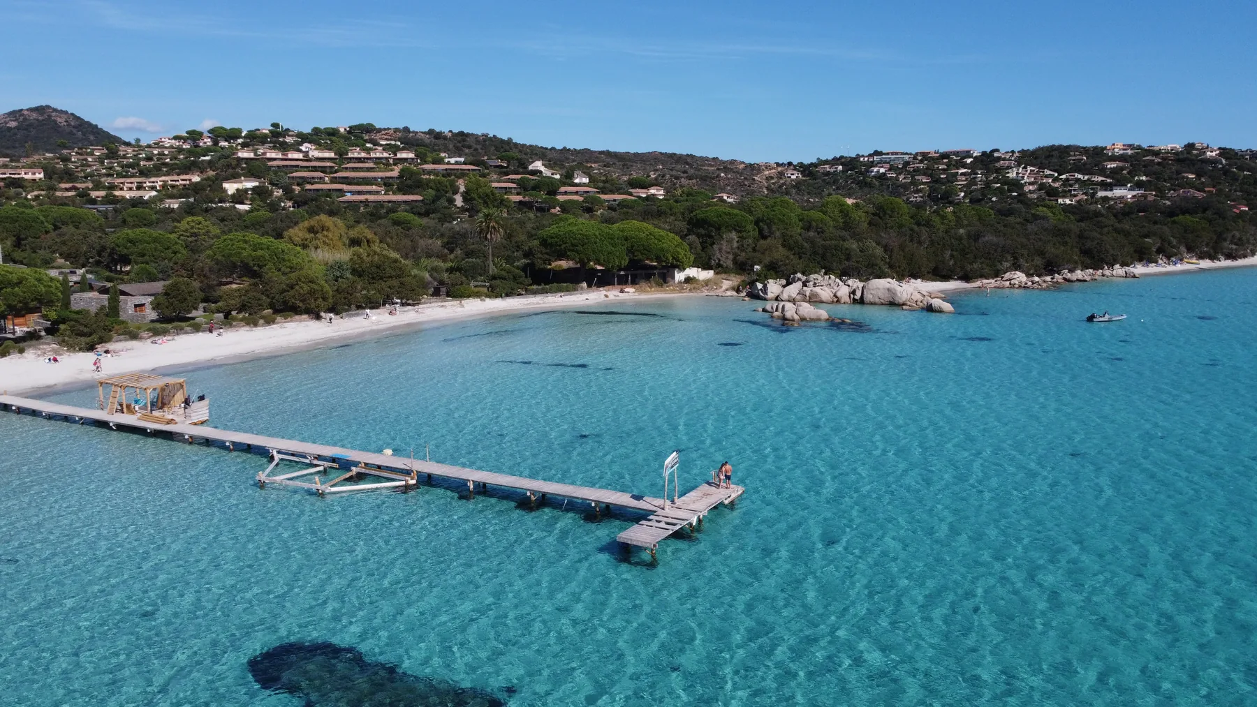 Turquoise water and a pale beach on the Corsican coast