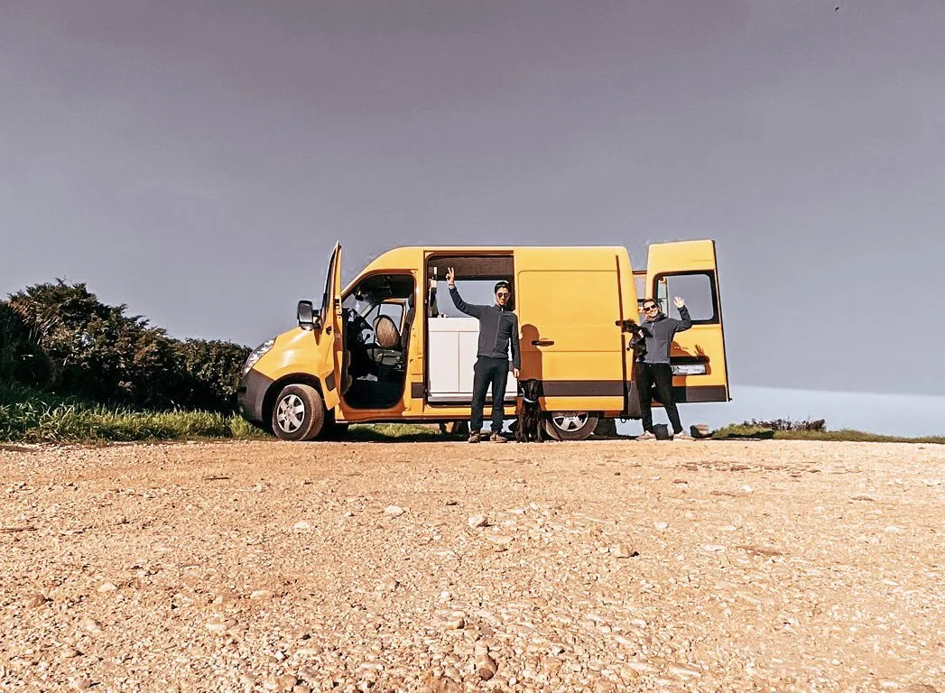 Leonie and João beside their van